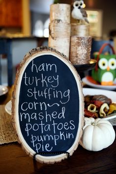 a chalkboard sign that says ham turkey stuffing, corned potatoes and pumpkin pie