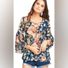 Color: Fall In Love Floral - Fit: This Style Fits True To Size. - V-Neck With Self-Tie With Tassles - 3/4 Length Bell Sleeves - Slips On Over Head - Woven Construction - Unlined - Made In Usa - Fiber Content: 100% Polyester - Care: Dry Clean Or Hand Wash 100% Poly Chiffon *Lined In Chest *Lace-Up Front With Tie Closure And Tassel Accents *Flared Sleeves Poet Tie Blouse Beautiful Floral Pattern Approx. 19” Pit To Pit * Approx. 25” Length (Shoulder To Hem) * Condition: Excellent Summer Floral Print V-neck Peasant Top, Chic V-neck Peasant Top With Floral Print, White Floral Sundress, Color Block Blouse, Floral Lace Blouse, Sheer Floral Blouse, Floral Fit, Floral Sundress, Short Dresses Casual