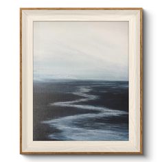 an abstract painting with black and white paint on the water, framed in a wooden frame