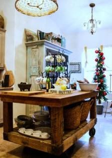 an old fashioned kitchen island with baskets on it