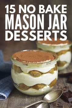 two jars filled with desserts sitting on top of a wooden table next to spoons