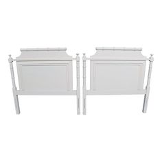 two white beds side by side against a white background with the headboard and foot board facing each other