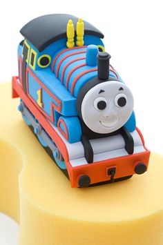 a thomas the train cake is on display