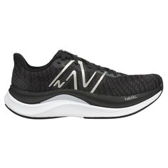 the new balance running shoe in black and white