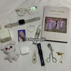 an assortment of personal items displayed on a bed