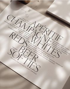 an advertisement for champagne white's red - beer softies is displayed on a table