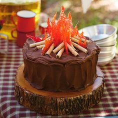 a chocolate cake sitting on top of a wooden table