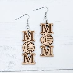 wooden earrings with the word mom and volleyball on it