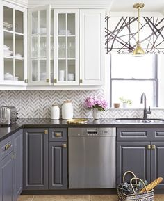 a kitchen with white cabinets and gray counter tops in the color scheme, which is very similar to other paint colors