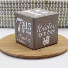 a wooden block with the number twenty five on it