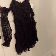 Brand New, Never Worn, Still Has Tags! Black Ruffle Gorgeous Dress With Cold Shoulders And Beautiful Sleeves. Comes With Removable Straps To Be Work Strapless Or With. I Am Obsessed With Every Aspect Of This Dress, Just Never Had Anywhere To Wear It- So Looking To Rehome! Purchased From Riffraff But It’s The Fanco Brand. Black Ruffle Dress For Going Out, Black Ruffled Dress For Going Out, Black Ruffles Mini Dress For Going Out, Black Frilly Dress, Luxury Black Fitted Ruffle Dress, Luxury Black Ruffled Dress, Black Off-shoulder Lace Mini Dress, Gothic Sleeveless Ruffled Dress, Black Lace Off-shoulder Mini Dress