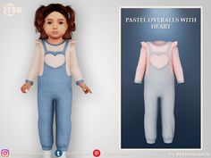 the doll is wearing overalls with heart patches on it's chest and back