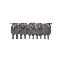 five metal sheep lined up in a row