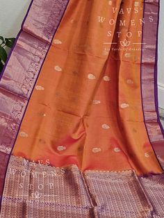 Orange Color Pure Kanchi Pattu Soft Silk Saree with stitched blouse Elevate your traditional wardrobe with this exclusive handpicked saree from Vavs Women's Stop. The beautiful combination of orange and purple in this handwoven Kancheepuram silk saree is a trendsetter in itself. The saree comes with a well-made, perfectly fitting stitched blouse, making it a hassle-free choice for any occasion. Our quick shipping from Prosper, Texas ensures that you receive your saree in time for all your auspic Traditional Orange Banarasi Silk Pre-draped Saree, Traditional Orange Pre-draped Saree With Zari Weaving, Traditional Orange Art Silk Pre-draped Saree, Orange Anarkali Chanderi Saree, Orange Anarkali For Traditional Ceremonies, Traditional Orange Saree With Self Design, Traditional Orange Self Design Saree, Orange Handloom Pre-draped Saree, Semi-stitched Orange Lehenga With Zari Weaving