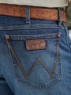 OUR WESTERN ROOTS MADE MODERN Model Number: 112325734 Wrangler® Retro® slim fit jeans nod to our history while introducing fits and washes suited for the modern cowboy. Designed with a closer fit and leg opening that still falls comfortably over boots, our men's Wrangler® straight leg slim fit jeans add extra style to the classic look you love. These jeans sit low on the waist and make it easy to show off your favorite belt buckle. That design detail is our Western heritage showing through, some Mens Western Style, Mens Western Wear, Toddler Bottoms, Wrangler Cowboy, Modern Cowboy, Wrangler Cowboy Cut, American Jeans, Toddler Tops, Indianapolis 500