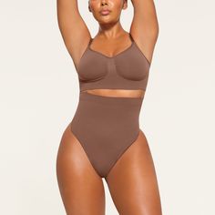 Get ultimate compression with our highest support level in this high-rise shapewear thong that sculpts, smooths, and tones your core and tummy. Wear this silky staple under everything to enhance your natural shape. Features removable adjustable straps. | SKIMS High-Waisted Thong | Medium Neutral | Core Control Natural Shapes, Shapewear, Onyx, Adjustable Straps, Lounge Wear, High Rise, High Waisted, How To Wear