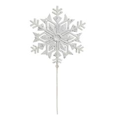 a white snowflake on top of a stick