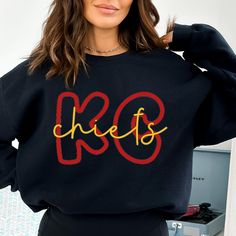 Most comfortable sweatshirts ever! Represent the KC Chiefs. Perfect gift for her or buy to match a bestie, family member or coworker! FREE SHIPPING IN THE US! MATERIALS: Unisex 50% cotton, 50% polyester sweatshirt. Warm, soft interior with Vinyl lettering.  PRODUCTION & SHIPPING: 2-4 day processing time.  2-5 day shipping.  CARE INSTRUCTIONS: Wash inside out in cold water.  Tumble Dry.  Do not bleach or iron over design. Kc Chiefs Shirts, Chiefs Sweatshirt, Kansas City Chiefs Svg, Chiefs Svg, Chiefs Shirts, Kansas City Football, The Chiefs, Diy Sweatshirt, Stylish Hoodies