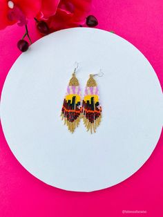 These beautiful beaded earrings are so colorful and perfect for all-day wear. They are definitely the perfect accessory to style up your look and add personality to your outfit. These lovely handmade earrings are made with sterling silver hooks and colorful beads. Each pair of earrings that we sell is authentic and one-of-a-kind! Finds more styles at https://www.etsy.com/shop/LatinxsCulturaViva?ref=simple-shop-header-name&listing_id=990207426&section_id=26730499 Thank you so much for vis Multicolor Round Bead Earrings For Gifts, Multicolor Chandelier Earrings With Ear Wire As Gift, Unique Multicolor Beaded Earrings As Gift, Multicolor Dangling Beads Earrings For Gift, Multicolor Beaded Drop Earrings For Pierced Ears, Multicolor Drop Beaded Earrings For Pierced Ears, Yellow Beaded Drop Earrings As Gift, Multicolor Adjustable Chandelier Earrings As Gift, Yellow Drop Beaded Earrings As Gift