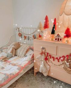 a bedroom decorated for christmas with teddy bears and lights on the bed, dresser and chest