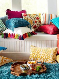 a couch with colorful pillows on it and the words how to rock color