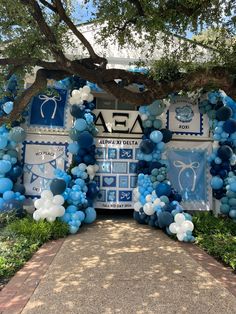 blue and white balloon arch for a baby shower