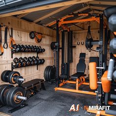 a home gym with weight machines and dumbs in the back wall is seen here