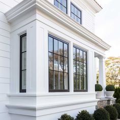 a white house with black trim and windows