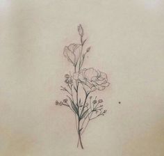 a flower tattoo on the back of a woman's shoulder