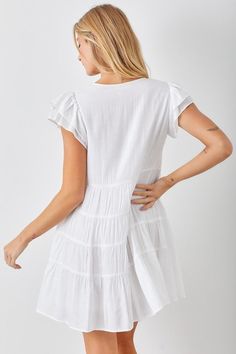 Specifications: Color: White Ruffle Sleeve details Tiered V-neckline Fully lined Chic Flowy V-neck Ruffle Dress, Fitted V-neck Tiered Dress With Ruffle Hem, Ruffled Mini V-neck Dress For Vacation, V-neck Tiered Dress With Ruffle Hem For Beach, White V-neck Tiered Dress For Summer, White V-neck Ruffle Dress For Day Out, V-neck Tiered Dress With Ruffle Hem For Day Out, Summer Casual V-neck Dress With Ruffle Sleeves, Casual Summer V-neck Dress With Ruffle Sleeves