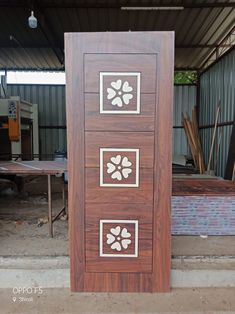 a wooden door that has some designs on it