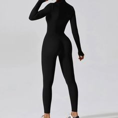 Elevate your fitness wardrobe with the Zipper Workout Romper. This Padded Bodysuit, designed for women who embrace high-intensity workouts and seek stylish comfort. Crafted from a premium blend of nylon and spandex, this long-sleeved gym jumpsuit offers a snug, supportive fit that moves with you. The elastic waist ensures a secure fit, while the padded interior and 4-way stretch fabric provide maximum comfort and flexibility. Key Features: Material: High-quality nylon and spandex blend for durab Sports Long Sleeve Jumpsuit, Black Long Sleeve Athleisure Jumpsuits And Rompers, High Stretch Black Jumpsuits And Rompers For Sports, Black Stretch Sporty Jumpsuits And Rompers, Black High Stretch Jumpsuits For Sports, High Stretch Black Jumpsuits For Sports, Versatile Black Stretch Jumpsuits And Rompers, Black Elastane Unitard For Gym, Sportswear Long Sleeve Jumpsuits And Rompers For Sports