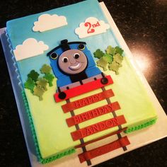 a thomas the train birthday cake on a table