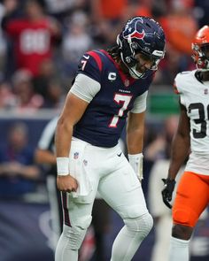 two football players standing next to each other