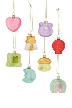 six glass ornaments hanging from strings in different colors