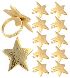 six gold star shaped rings and five smaller stars with one ring in the middle, all set on top of each other