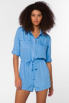 We love rompers for spring and summer, and there’s not a better cut or style than the utility romper! The Luba romper is one of our favorites for warm weather because it features roll-tab sleeves, buttons, a drawstring waist, and side pockets. Versatile, lightweight, and totally effortless, you just need to throw it on and head out the door! Material: 100% Tencel™ Eco-Friendly Machine wash cold, tumble dry low Color: Polar Blue Model is 5'9" and wearing a size S Imported Spring Vacation Jumpsuits And Rompers With Pockets, Spring Jumpsuits And Rompers With Pockets For Day Out, Summer Utility Jumpsuits And Rompers, Utility Jumpsuits And Rompers For Summer Workwear, Blue Summer Jumpsuits And Rompers With Pockets, Summer Blue Jumpsuits And Rompers With Pockets, Short Sleeve Jumpsuits And Rompers With Pockets For Beach, Summer Casual Button-up Jumpsuits And Rompers, Summer Utility Button-up Jumpsuits And Rompers