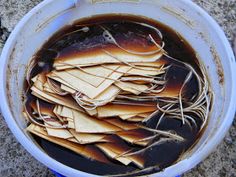 a bucket filled with lots of brown liquid