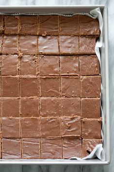 a pan filled with brownies sitting on top of a counter