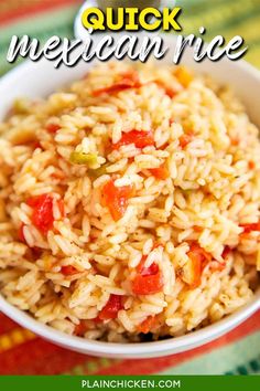 mexican rice with tomatoes and peppers in a white bowl on a colorful tablecloth text reads quick mexican rice