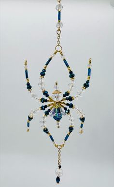 a blue and gold chandelier hanging from a ceiling