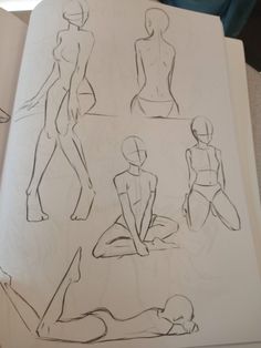 an open book with drawings of female mannequins