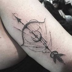 a tattoo on the arm of a woman with arrows and an arrow in her hand