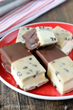 four pieces of chocolate fudge on a red plate