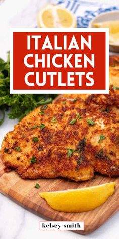 chicken cutlets on a cutting board with lemon wedges