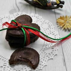 two pieces of chocolate on a white doily