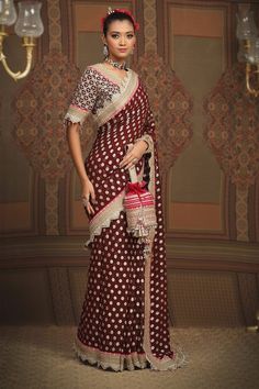 Maroon floral pattern saree, embellished with intricate gota, dori and badla work and rani pink border. Comes with silk chanderi padded blouse with scalloped neckline. - Aza Fashions Brocade Pre-draped Saree With Zari Work, Brocade Pre-draped Saree With Resham Embroidery, Silk Pre-draped Saree With Intricate Embroidery For Transitional Season, Designer Wear Transitional Pre-draped Saree With Intricate Embroidery, Silk Pre-draped Saree With Intricate Embroidery For Designer Wear, Pre-draped Saree With Intricate Embroidery, Festive Brocade Pre-draped Saree With Zari Work, Transitional Designer Wear Pre-draped Saree With Intricate Embroidery, Designer Transitional Pre-draped Saree With Intricate Embroidery