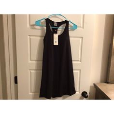 This Women's Calia Dress Is Perfect For Exercise And Everyday Wear. With A Scoop Neck And Sleeveless Design, It Is Made From A Blend Of Nylon And Spandex For Stretch And Breathability. The Dress Is Black In Color And Comes In Size Xs. Its Features Include Slimming And A Pullover Closure. The Dress Is New With Tags And Is Great For Summer, Fall, And Spring. Its Style Is Versatile, With Options For Fit And Flare, Shift, Tank Dress, Mini, Slip Dress, Trapeze And Swing, A-Line, Shirt Dress, Sundress, And Sheath. Whether You're Working Out Or Running Errands, This Dress Is A Must-Have. Black Tank Dress For Spring, Sleeveless Stretch Mini Dress For Workout, Stretch Sleeveless Mini Dress For Workout, Fitted Tank Dress In Black, Fitted Tank Black Dresses, Fitted Black Tank Dress, Scoop Neck Workout Dress For Spring, Black Stretch Racerback Dress, Sleeveless Stretch Workout Dress