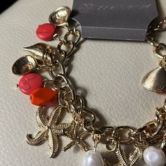 Daisy Fuentes Bracelet With Gold Shells, Starfish, Pearls & Coral Charms! So Pretty. Great For A Beach Vacation! New! Extender Makes It Bigger! Bundles & Offers Welcome! Bohemian Charm Bracelet For Beach, Starfish Charm Bracelets For Beach Season, Casual Orange Jewelry For Beach, Bohemian Charm Bracelet For Beach With Lobster Clasp, Coral Bracelet Jewelry For Beach, Casual Orange Beach Jewelry, Coral Beach Bracelet Jewelry, Casual Bracelets With Starfish Charm For Vacation, Red Bracelet Jewelry For Vacation