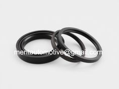 two black rubber seals on white background